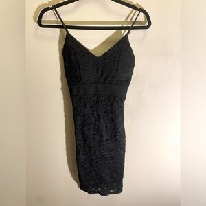 Black dress with lace and straps. Size small.